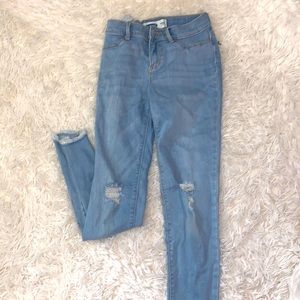 skinny jeans with some rips on knees